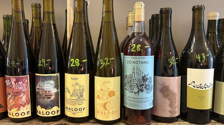 shelf of natural wines with prices