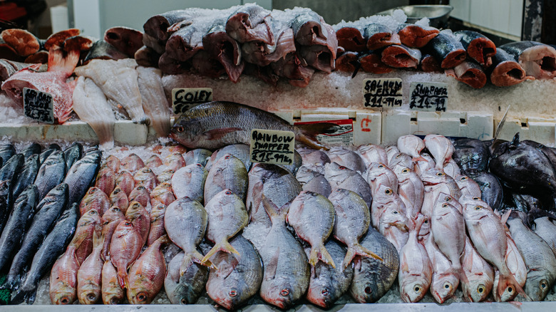 raw fish displayed at market