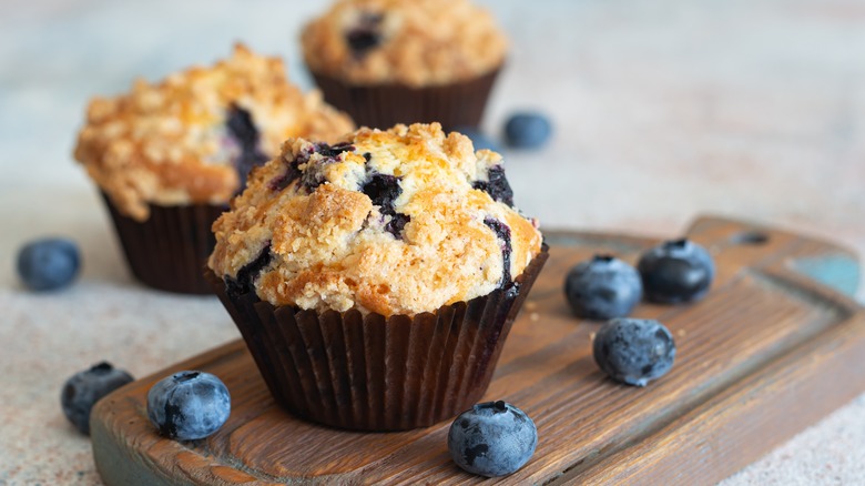 blueberry muffins on a cutting board