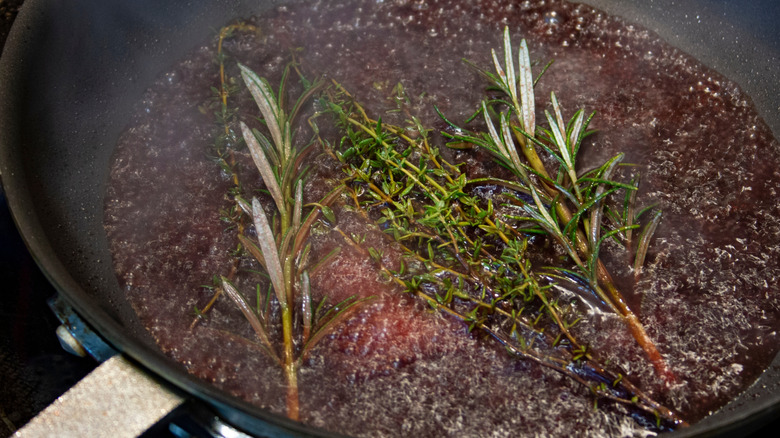 herbs in deglazed pan