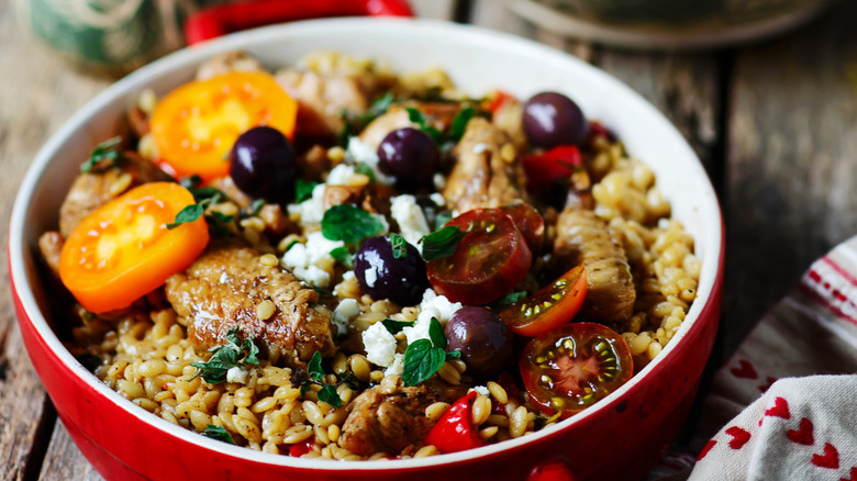 displayed Greek-style orzo in red bowl