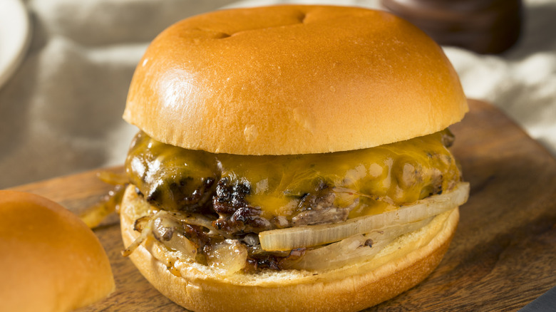 Close-up of Oklahoma onion burger on cutting board