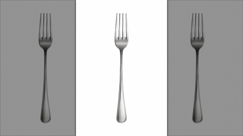 single fork on white background