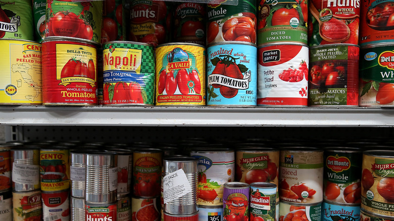 Canned tomatoes on store shelf