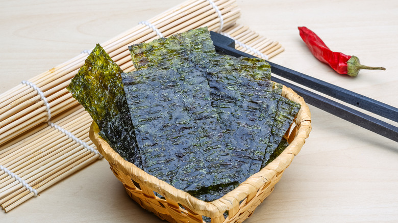 Nori sheets with sushi bamboo mat and chop sticks