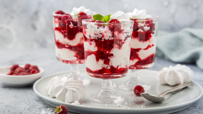 Glasses of raspberry Eton Mess dessert