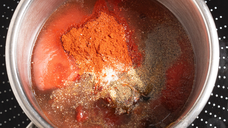 Spices and tomato sauce in a saucepan