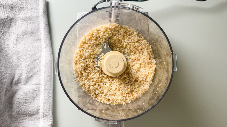 Fresh sourdough breadcrumbs in food processor bowl