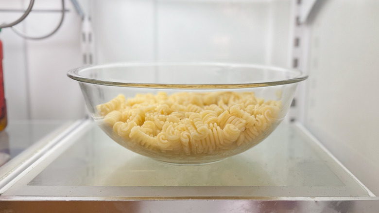 Radiatore pasta chilling in glass bowl in refrigerator