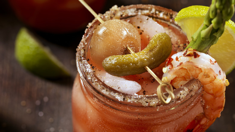 bloody mary cocktail with pickle garnish