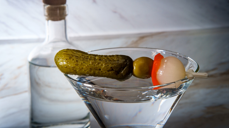 A martini garnished with pickles