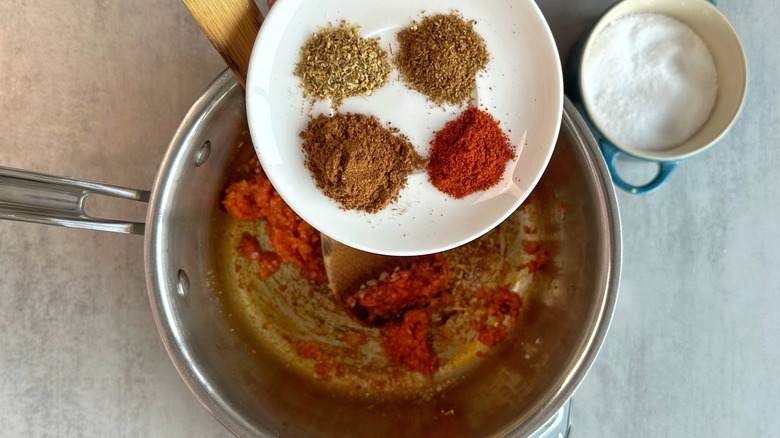 plate of spices above saucepan