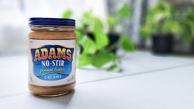 Adams peanut butter on counter