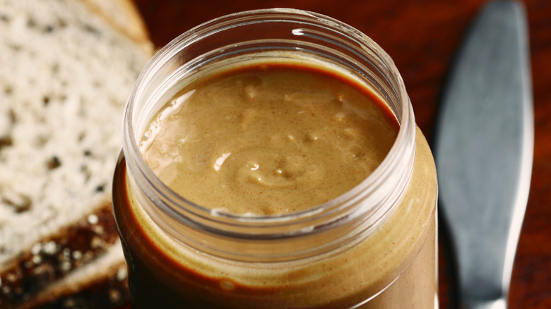 Open jar of crunchy peanut butter