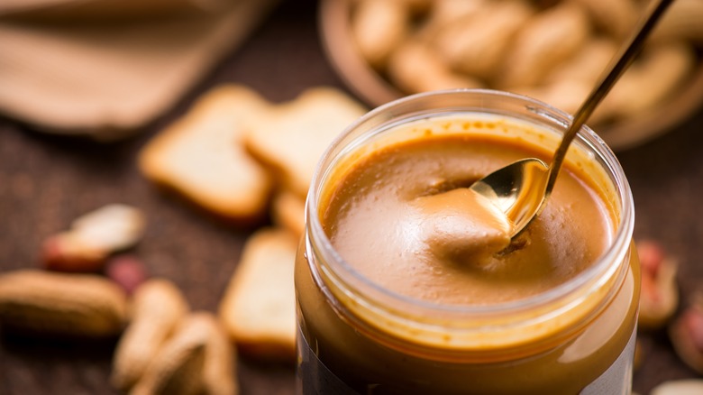 Jar of peanut butter with spoon