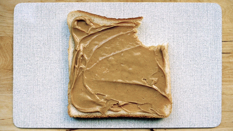 Peanut butter toast with bite taken