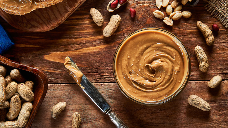 Bowl of peanut butter and knife