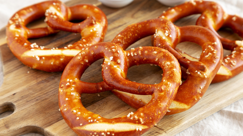 Soft pretzels on wooden board