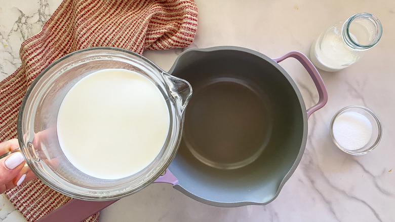 pouring milk into pot
