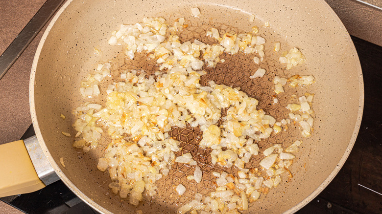 onion and garlic in pan