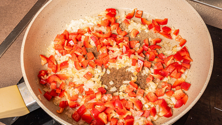 onion, garlic, pepper in pan