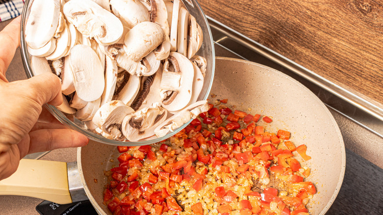 mushrooms going in pan