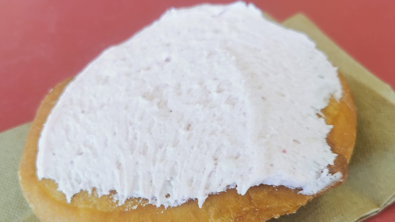 close up of a frosted Persian Donut