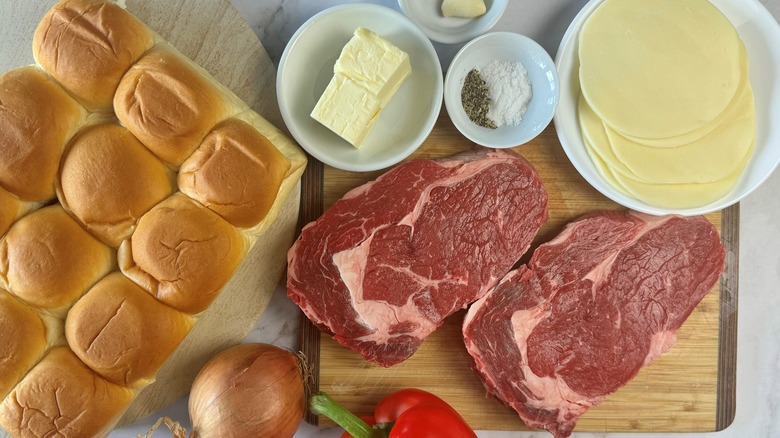 steaks with cheese and buns