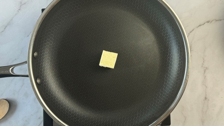 butter in black frying pan