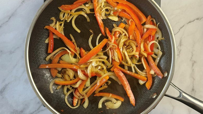 peppers and onions in pan