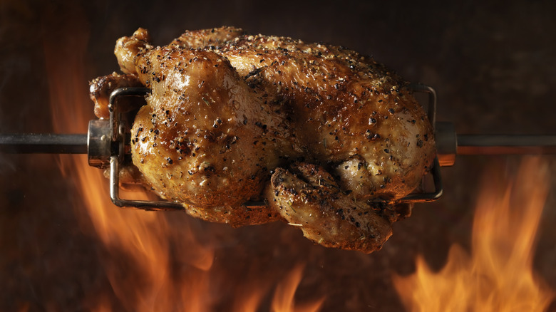 rotisserie chicken roasting on a spit