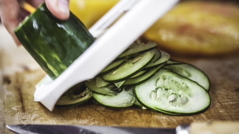 Using mandolin to slice cucumber