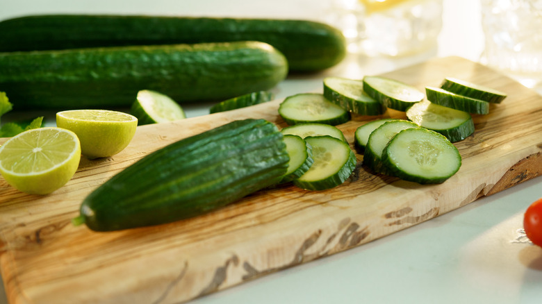 Sliced cucumbers on cutting board