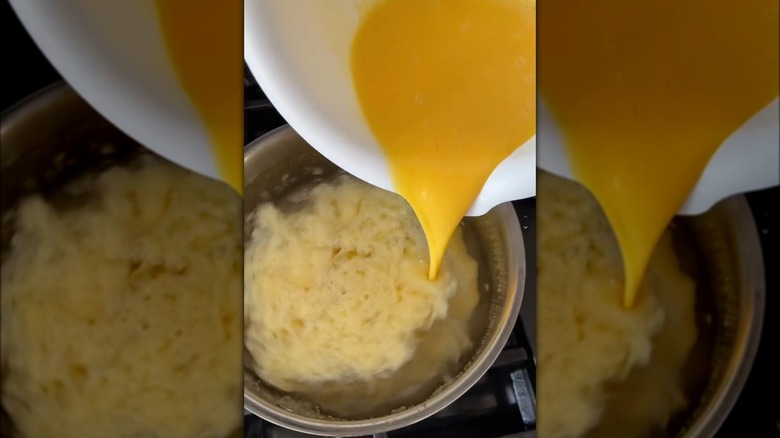 Egg mix poured into water.