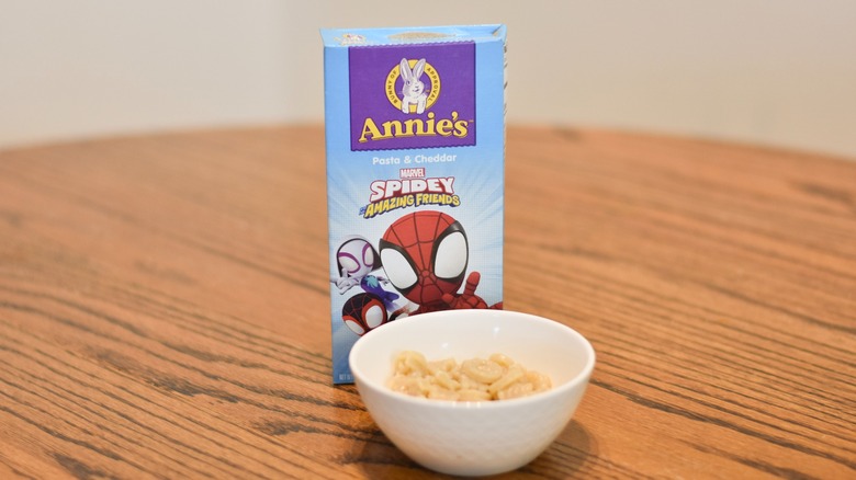 A box of Annie's macaroni and cheese next to a bowl