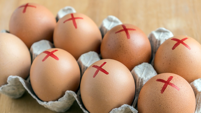 Recalled eggs with x marks