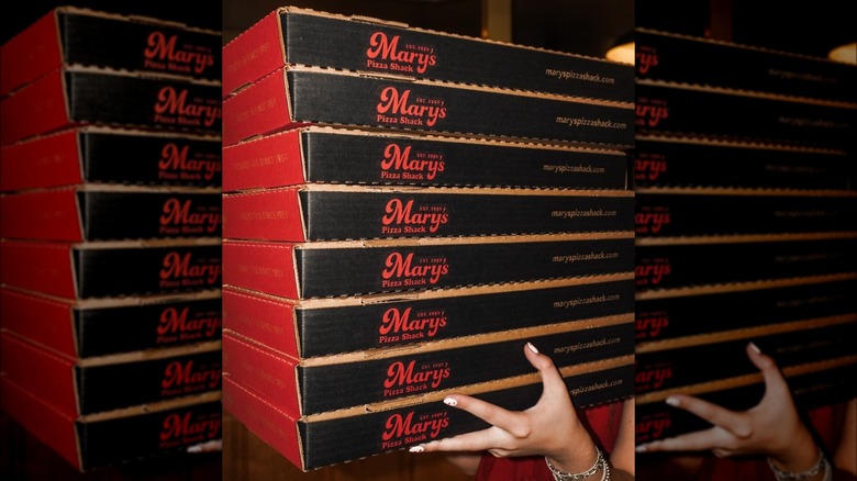 Stack of Mary's pizza boxes