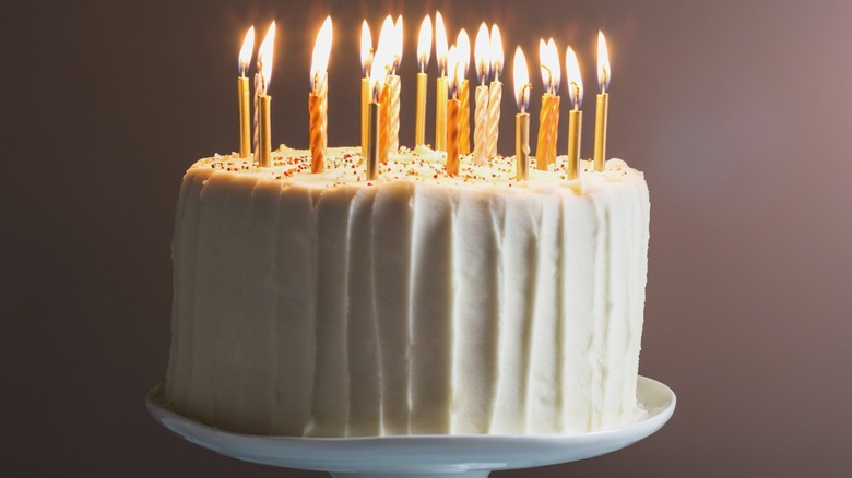 mashed potato coated birthday cake with candles