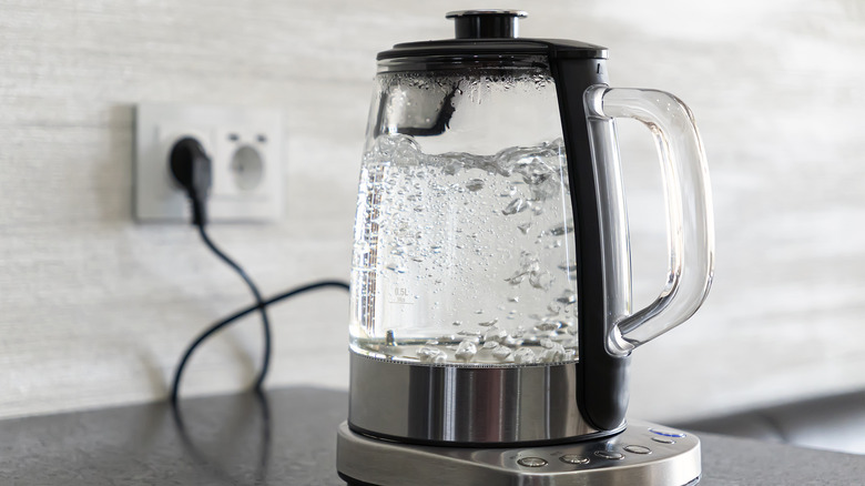 Boiling water in a glass electric kettle