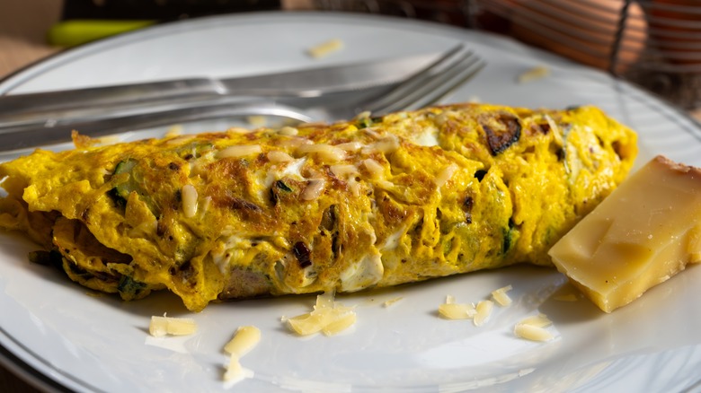 a vegetable omelette on a white plate