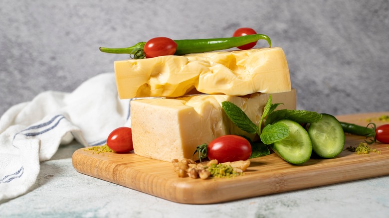 Gruyere cheese on cutting board