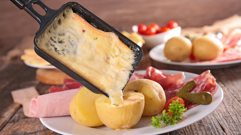 Raclette poured over potatoes