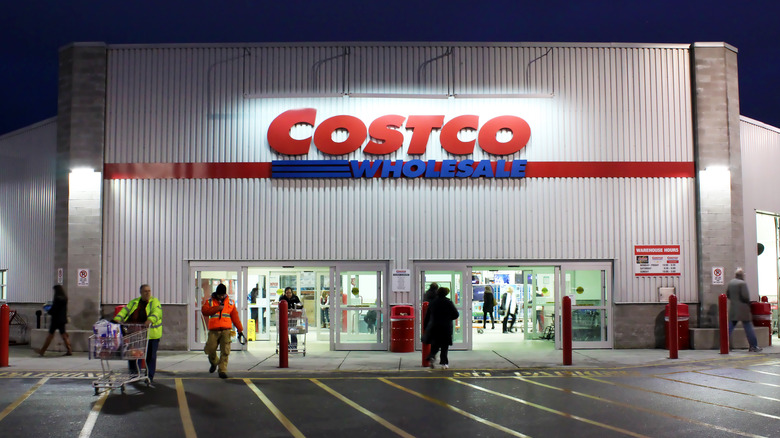 People entering and leaving Costco