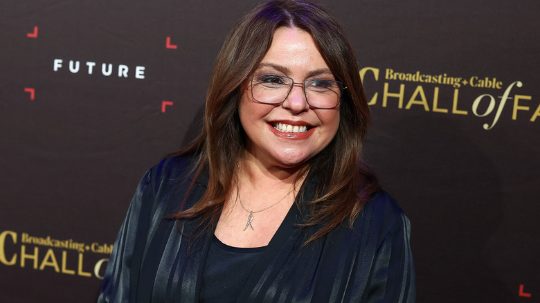 Rachael Ray smiling on an event red carpet