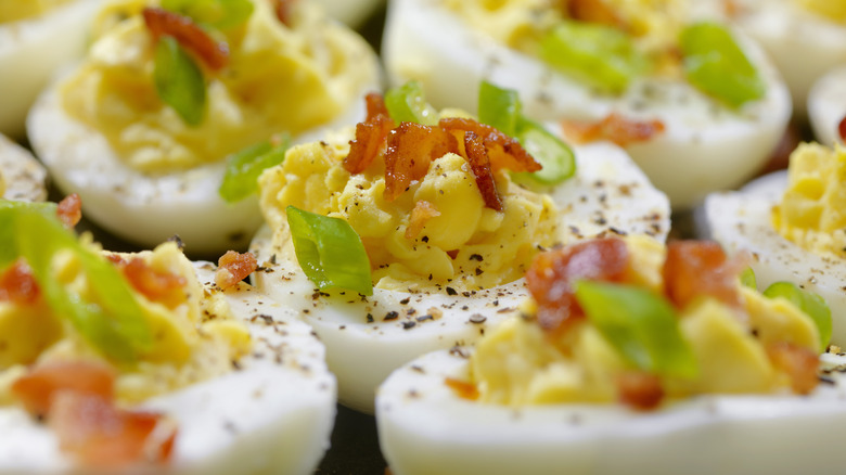 Deviled eggs with bacon and green onion