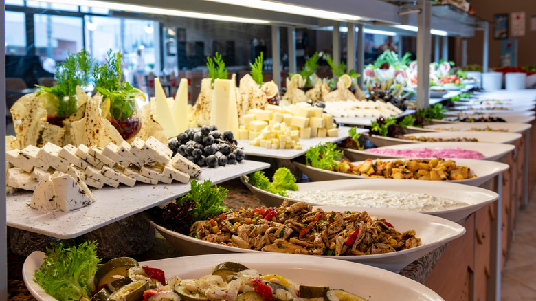 Dishes of food in a restaurant salad bar