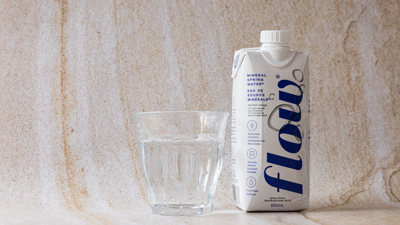 Package of Flow water and glass cup