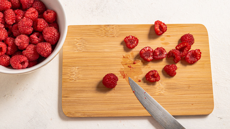 Cutting raspberries in half