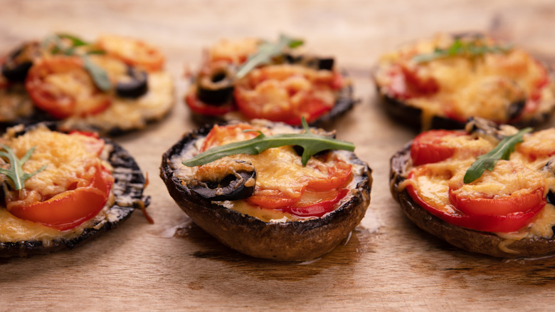 Portaobello pizzas on a baking tray