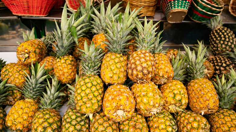 Pile of pineapples in store